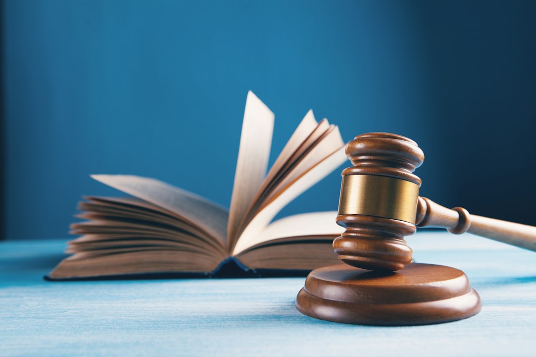 judges-gavel-and-open-book-on-table-ozs0tpf8qt0